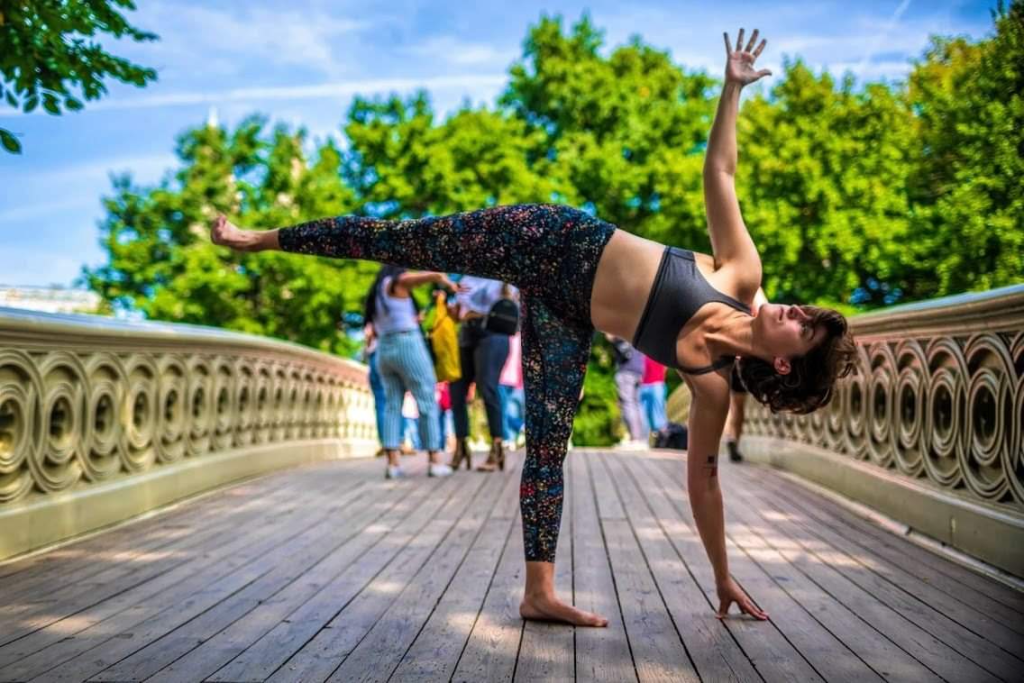 Alexis in balancing half moon pose on a sunny day